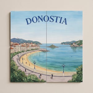 May include: A watercolor print of Donostia, a coastal city, featuring a curved beach, buildings, and a bay. The sky is light blue, and the water is a darker blue. The word "DONOSTIA" is printed in blue at the top.