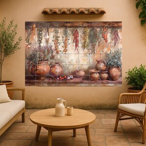 May include: A decorative wall art piece depicting a rustic kitchen scene. The artwork shows hanging herbs and spices, terracotta pots, and various produce. The colour palette includes warm earth tones and vibrant reds.