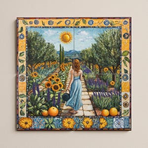 May include: A framed painting depicts a woman in a blue dress walking through a garden path lined with sunflowers and lavender. The artwork features a bright yellow sun, olive trees, and orange fruit. The border has decorative floral and tile patterns.