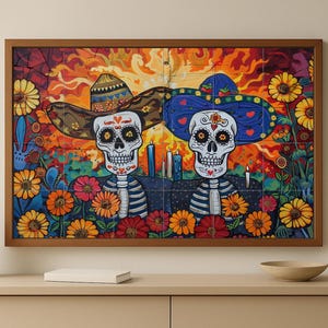 May include: A framed artwork featuring two stylized skeleton figures wearing sombreros, surrounded by colorful flowers. The artwork has a vibrant color palette with reds, oranges, blues, and yellows. The skeletons have detailed facial features and are decorated with hearts and floral designs.