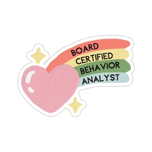 May include: A pink heart with a rainbow-colored arc above it. The arc has the words "BOARD CERTIFIED BEHAVIOR ANALYST" written on it.