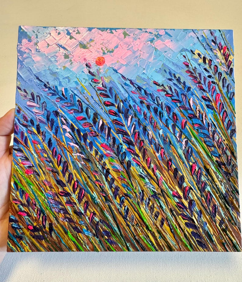May include: A painting depicting a field of purple and pink wildflowers with a bright orange sun in the background. The painting is created using a textured style with thick brushstrokes.
