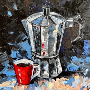 May include: A red coffee cup with a dark brown liquid inside sits next to a silver metal coffee pot with a black handle. The background is a dark blue and black abstract painting.