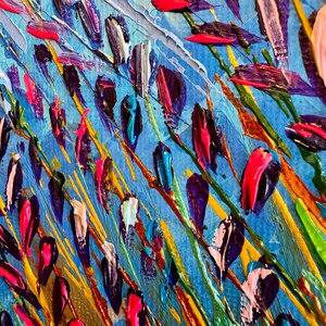May include: Abstract painting with a blue background and colourful brushstrokes. The brushstrokes are in various shades of blue, green, yellow, orange, pink, and purple. The painting has a textured look, as if it were painted with a palette knife.