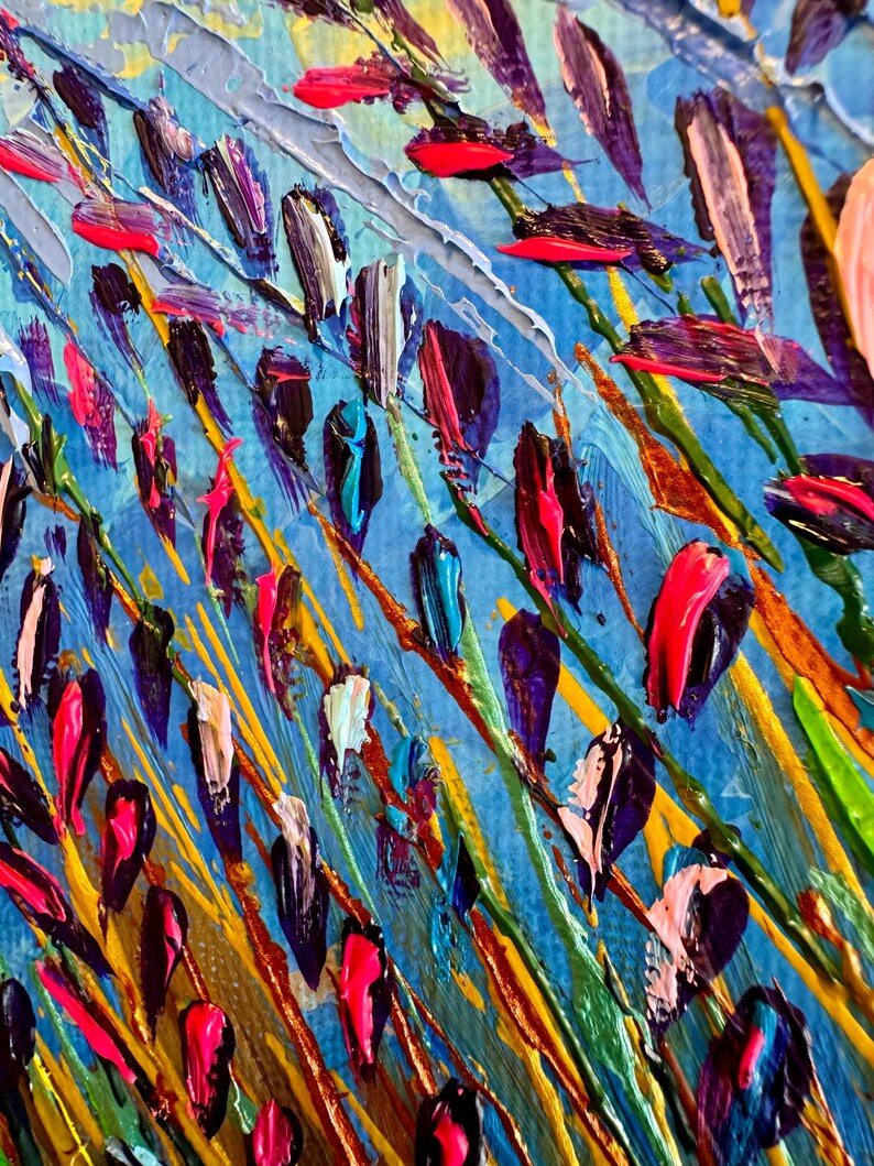 May include: Abstract painting with a blue background and colourful brushstrokes. The brushstrokes are in various shades of blue, green, yellow, orange, pink, and purple. The painting has a textured look, as if it were painted with a palette knife.