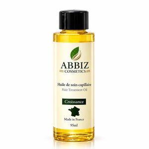 May include: A clear plastic bottle filled with golden hair treatment oil, featuring a black screw-top cap. The label displays the text ABBIZ COSMETICS, Huile de soin capillaire, Hair Treatment Oil, Croissance, Made in France, and 95ml.