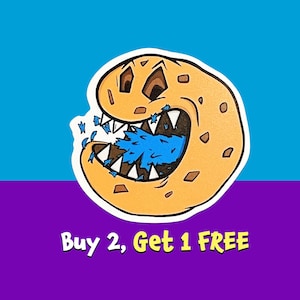May include: A cartoon cookie monster with a big toothy grin, biting into a blue frosting-filled cookie. The text "Buy 2, Get 1 FREE" is below the cookie monster.