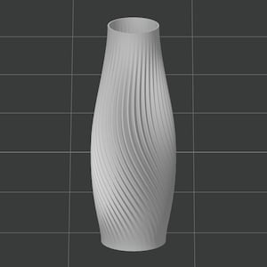 Puede incluir: Un jarr&oacute;n de cer&aacute;mica blanco con un dise&ntilde;o de textura en espiral. El jarr&oacute;n es alto y delgado, con una base redonda y una abertura estrecha.