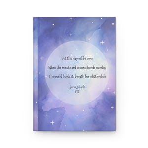 May include: A hardcover journal with a celestial design. The cover features a watercolor-style background in shades of blue and purple, with a large white circle in the center. The text "But this day will be over" is printed on the cover.