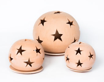 Handmade terracotta lanterns with star patterns from Tunisia in various sizes