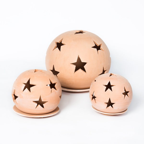 Handmade terracotta lanterns with star patterns from Tunisia in various sizes