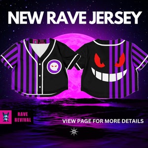 May include: A black and purple baseball jersey with a white ghost face on the back and a white circle with a ghost face on the front. The jersey has purple and black stripes. The text "NEW RAVE JERSEY" is at the top of the image. The text "RAVE REVIVAL" is at the bottom of the image.