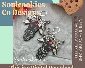 May include: A pair of black goat head earrings with silver horns and red lips. The earrings are laser-ready designs, as indicated by the text. The image also includes the text "Soulcookies Co Designs" and "This is a Digital Download SVG PNG PDF".