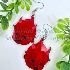 May include: Red devil baby face earrings with silver hooks. The earrings are made of acrylic and have a glossy finish.