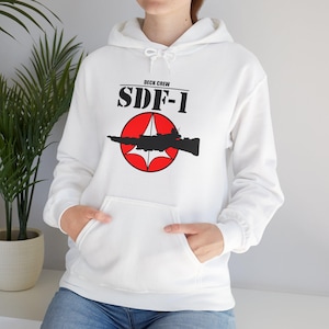 May include: White hoodie with a black and red graphic of a spaceship with the text "Deck Crew SDF-1" printed on the front.