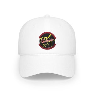 May include: White baseball cap with a red, black, and yellow embroidered patch that says "International Rescue Organization" and "Thunderbirds" with a lightning bolt graphic. The patch also says "Special Rescue Operations" and "Est. 1965".