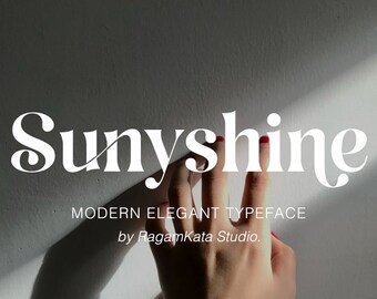 Op de afbeelding: Witte tekst op een grijze achtergrond luidt "Sunyshine" in een modern, elegant lettertype. Onder de tekst staat "MODERN ELEGANT TYPEFACE by RagamKata Studio."