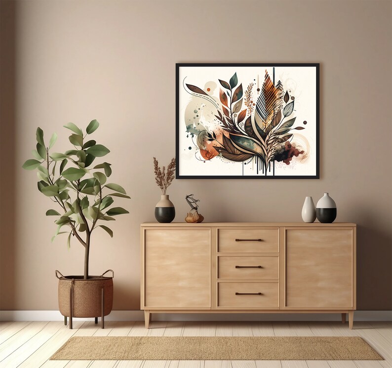 May include: A framed abstract art print with a brown, green and beige colour scheme. The print features a stylised floral design with leaves and branches. The print is hanging on a light beige wall above a wooden dresser.