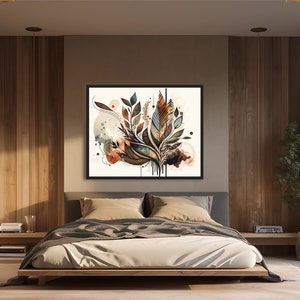 May include: A framed abstract art print with a watercolour style design featuring a cluster of stylised leaves in shades of brown, green, and blue. The leaves are arranged in a loose, organic pattern and appear to be dripping with paint. The background is a light beige with hints of orange and brown.