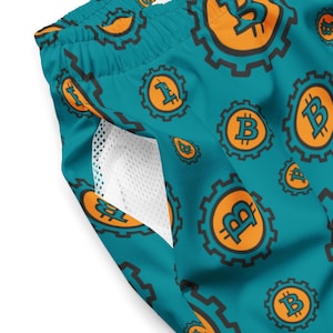 May include: Teal swim trunks with a repeating pattern of orange Bitcoin symbols inside black gears. The trunks have a white mesh pocket lining.
