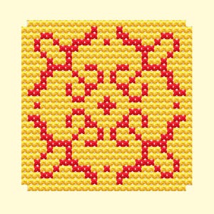 May include: A square cross-stitch design featuring a yellow background with a red pattern. The pattern appears to be a stylized image of a face or character. The design is centered on a light yellow background.