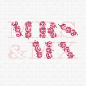Può includere: Un ricamo a punto croce con le parole "Mr. & Mrs." in rosa, dove ogni lettera è composta da piccole rose rosa.