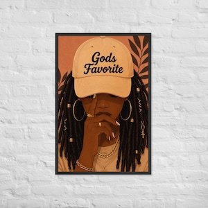 May include: A framed art print featuring a person with dark skin and long locs adorned with gold beads and an ankh charm. The person wears a tan baseball cap with the text Gods Favorite, large gold hoop earrings, a gold chain, and gold rings.