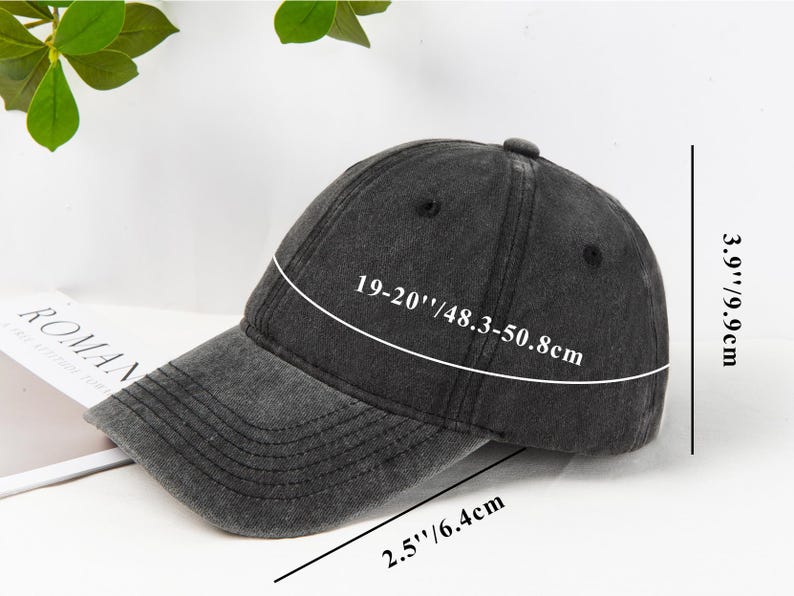 May include: A dark gray baseball cap with a curved brim. The cap measures 19-20 inches (48.3-50.8cm) in circumference and 3.9 inches (9.9cm) in height. The brim is 2.5 inches (6.4cm) long. The cap has a distressed look.
