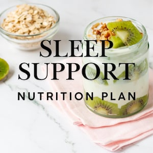 May include: A glass jar filled with layers of yogurt, kiwi slices, and nuts, alongside a bowl of oats. The text "SLEEP SUPPORT NUTRITION PLAN" is displayed in black font on a white marble surface, with a pink napkin underneath the jar.