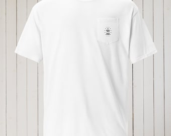 May include: White pocket t-shirt with a small black design on the pocket. The design includes the letter "M" with a cross above it and two small hearts below. The shirt has short sleeves and a crew neck.