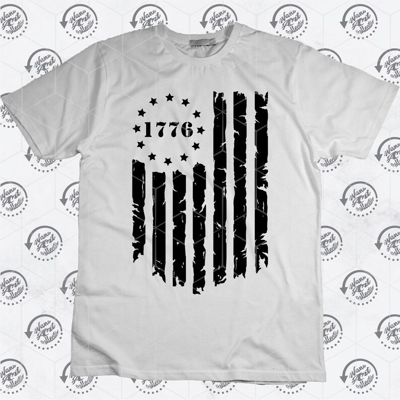 May include: A white t-shirt featuring a black distressed American flag design. The flag has 13 stripes and a circle of stars with the year 1776 in the centre.