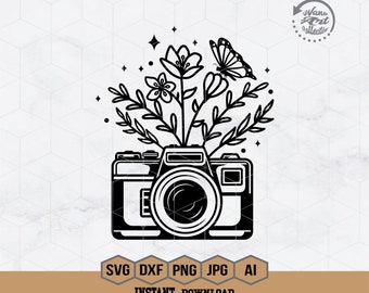 May include: Black and white illustration of a camera with flowers and a butterfly growing out of the top. The text "SVG DXF PNG JPG AI" is below the image.