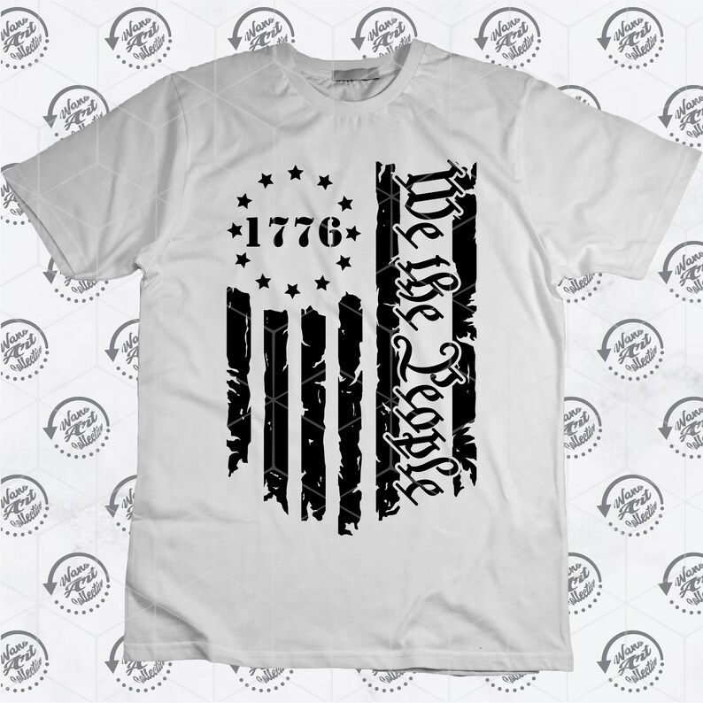 May include: White t-shirt featuring a black distressed American flag design. The flag has 13 stripes and 13 stars in a circle with the year "1776" in the centre. The words "We the People" are written vertically on the right side of the flag.
