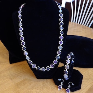 Amethyst and silver necklace, bracelet, and earring set