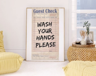 May include: A vintage-style guest check with the text "Wash Your Hands Please" printed in black on a white background. The check has a blue header and a pink background with blue lines.