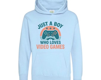 May include: A light blue hoodie with a front graphic that reads "JUST A BOY WHO LOVES VIDEO GAMES." The graphic features a retro-style controller design with orange, teal, and blue colors. The hoodie has a front pocket and a hood.
