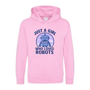May include: A light pink hooded sweatshirt with the text "JUST A GIRL WHO LOVES ROBOTS" and a cartoon robot graphic. The robot is blue with a white background and is inside a blue circle.