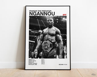 May include: Black and white photo of Francis Ngannou, a mixed martial arts fighter, holding the UFC heavyweight championship belt. The text "FRANCIS THE PREDATOR NGANNOU" and "UFC" are at the top of the poster. The text "RECORD: 17-3-0" is at the bottom of the poster. The text "HEIGHT: 6'4", "WEIGHT: 260 lbs", "REACH: 83", "STANCE: Orthodox", and "DOB: Sep 05, 1986" are on the left side of the poster.
