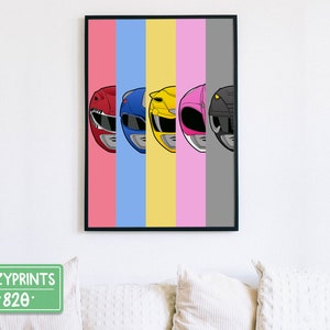 May include: A print featuring the Power Rangers helmets in a row. The helmets are red, blue, yellow, pink, and black. The background is a colourful striped pattern of pink, blue, yellow, pink, and grey.