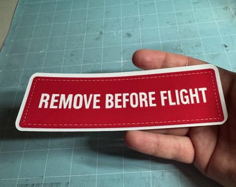 Remove Before Flight Sticker – Red Tag Design