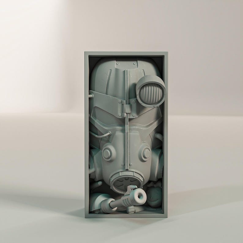 May include: A gray, detailed sculpture of a gas mask and helmet, encased in a rectangular frame. The mask features a prominent circular light and a nozzle. The overall design suggests a post-apocalyptic or sci-fi theme.