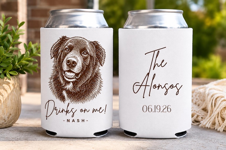 May include: Two white foam can coolers featuring a brown line-art illustration of a dog. The left cooler displays the text "Drinks on me!" and "NASH". The right cooler features the text "The Alonsos" in script and the date "06.19.26" below it.