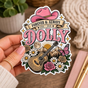 May include: A die-cut sticker featuring a pink cowboy hat above a banner with the text FOREVER & ALWAYS 1946 - 2026. Below, the word DOLLY is written in large pink letters, accompanied by an acoustic guitar, mountains, a sun, a moon, and flowers.