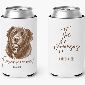 May include: Two white foam can coolers featuring a brown line-art illustration of a dog. One cooler displays the text "Drinks on me! - NASH -" and the other shows the text "The Alonsos" above the date "06.19.26" in a brown script and serif font.