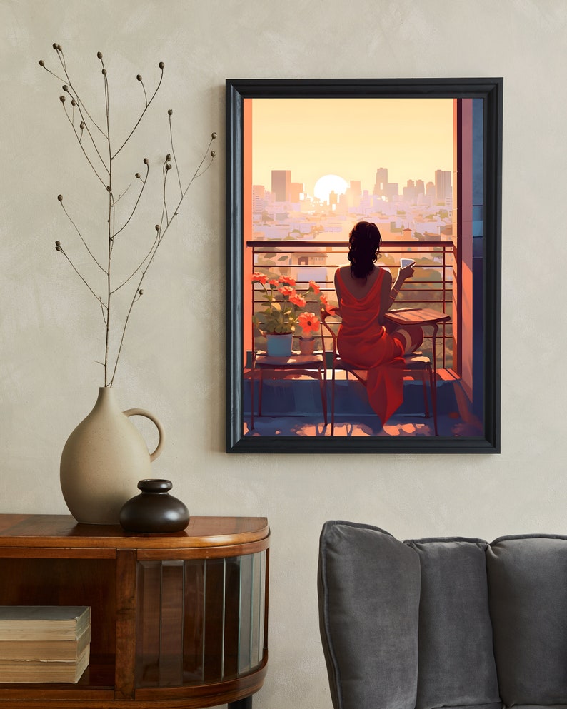 May include: A woman in a red dress sits on a balcony overlooking a city skyline at sunset. She is holding a cup and looking out at the view.