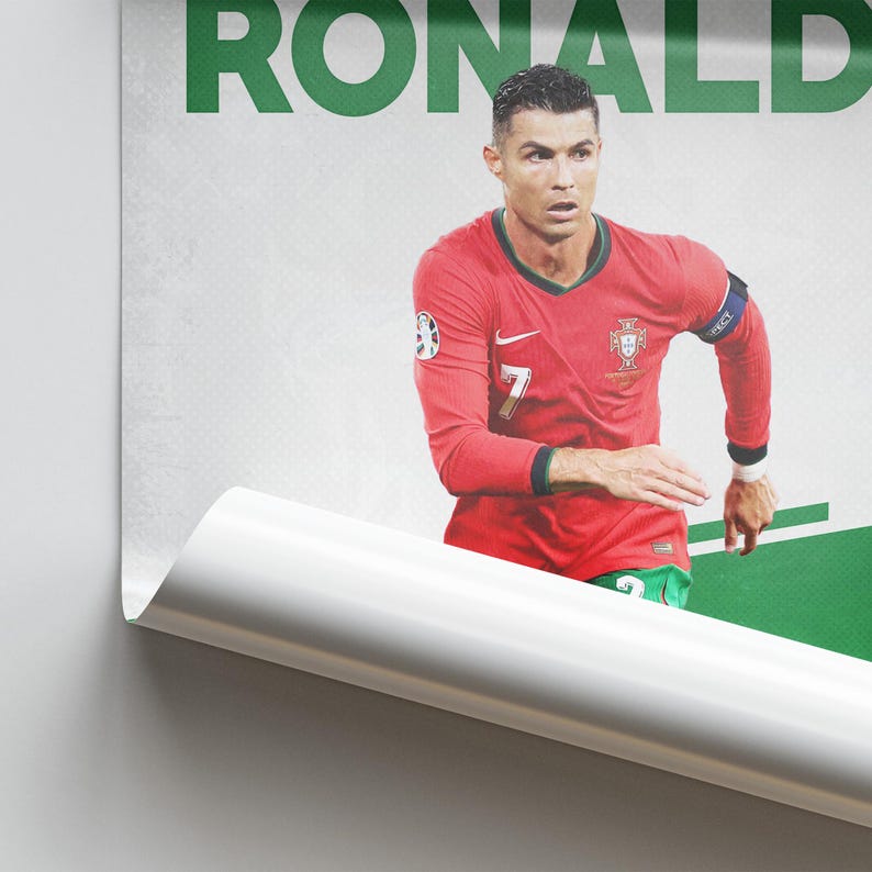 May include: A poster featuring a portrait of Cristiano Ronaldo in a red Portugal soccer jersey with the number 7. The word "RONALDO" is printed in green at the top. The background is white and green.