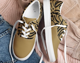 Women’s lace-up canvas shoes with abstract calligraphy strokes on gold-brown bronze background