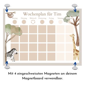 May include: A weekly planner with a jungle theme. The planner has a beige background with a grid of squares for each day of the week. The days of the week are labeled in German. The planner has a sloth, zebra, and giraffe illustrations. The planner has four magnets on the back.