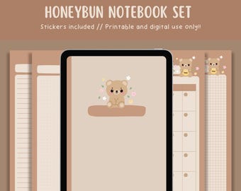 May include: A Honeybun notebook set with a tan cover featuring a cute bear illustration. The set includes a tablet with a bear graphic, and several notebook pages with lined, dotted, and grid layouts. The text "Stickers included // Printable and digital use only!!" is at the top.