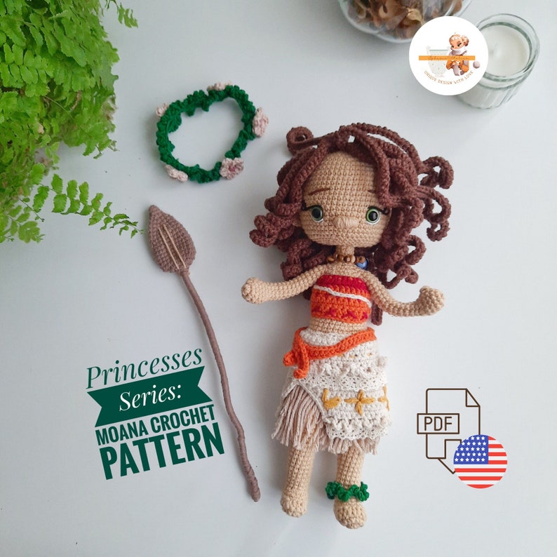 May include: A crocheted Moana doll from the Princesses Series, featuring a brown-haired doll with a red and white top, a white skirt, and a spear. A green floral headband and a PDF pattern are also included.